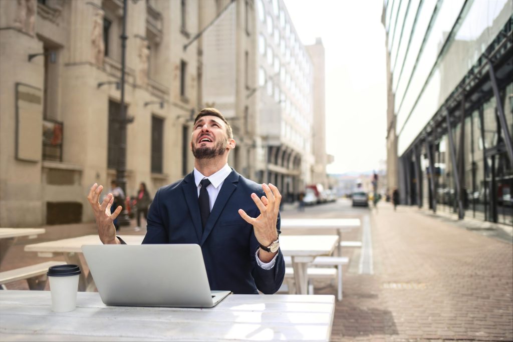 man stressed on computer